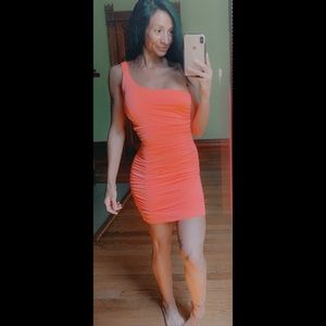 One shoulder mini dress with ruched back.